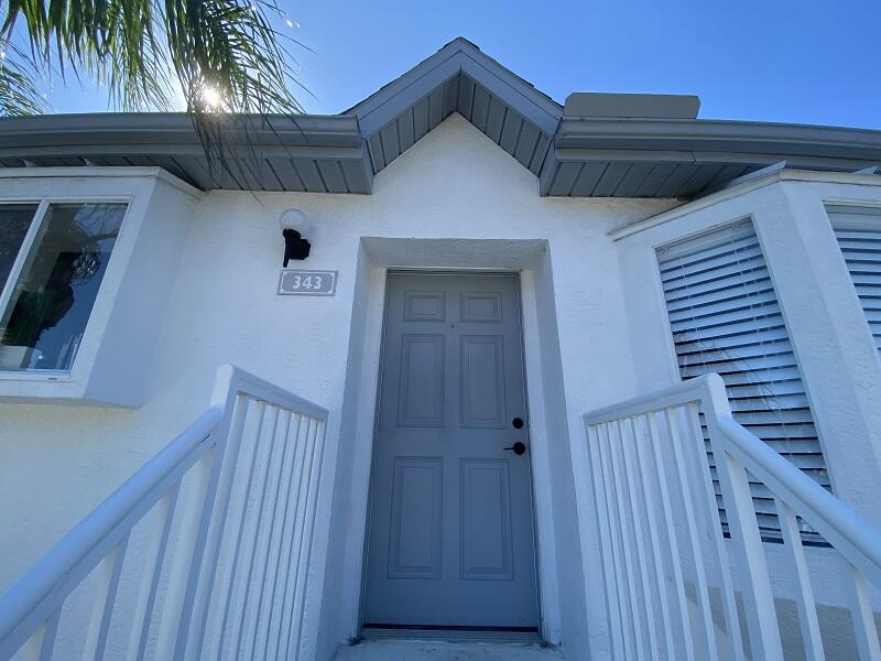 343 Ocean Park Lane, Unit V110 Cape Canaveral, FL 32920 - Photo 25 of 25 a view of a house with wooden deck