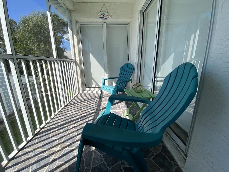 343 Ocean Park Lane, Unit V110 Cape Canaveral, FL 32920 - Photo 10 of 25 a view of a balcony with chairs