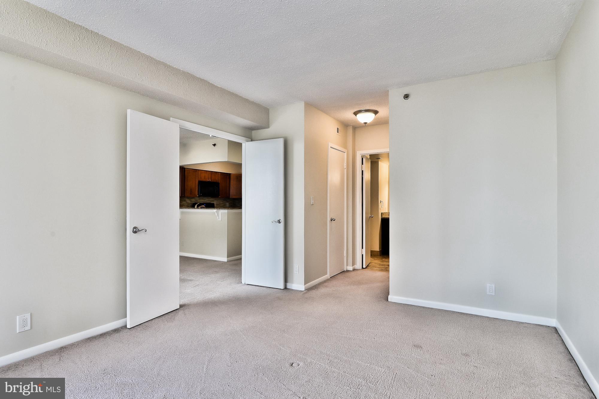 5505 Seminary Road, Unit 1817N Falls Church, VA 22041 - Photo 16 of 31 an empty room with a ceiling fan and shower
