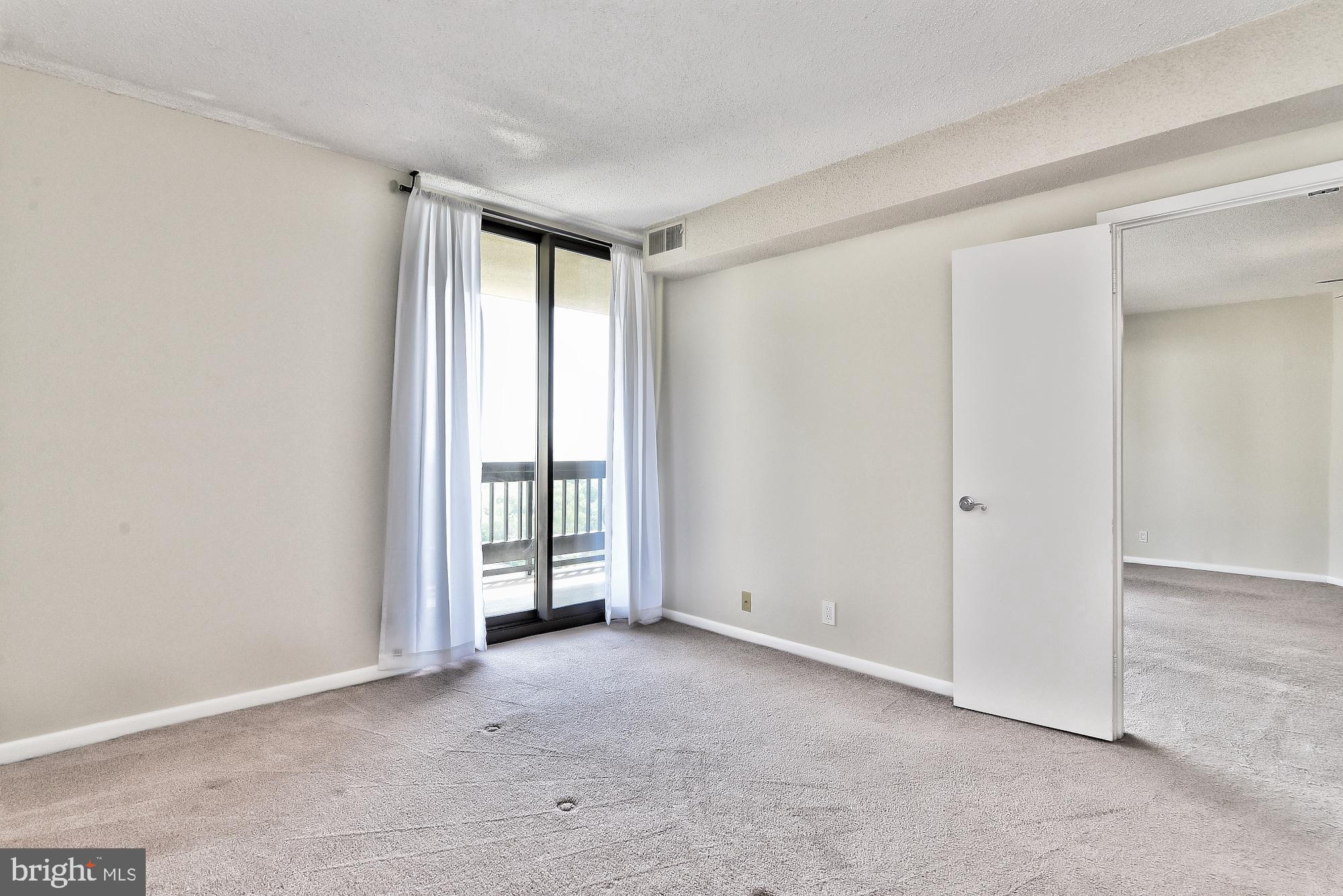 5505 Seminary Road, Unit 1817N Falls Church, VA 22041 - Photo 18 of 31 an empty room with windows
