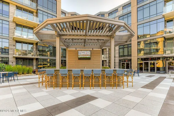 a view of a building with a bench in front of building