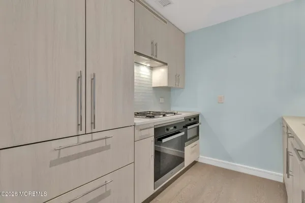 a kitchen with cabinets and appliances