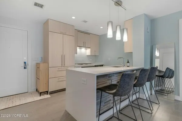 a kitchen with a sink cabinets and window