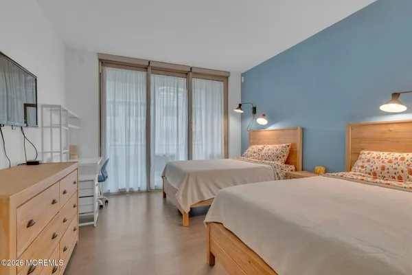 a bedroom with a bed and a cabinets