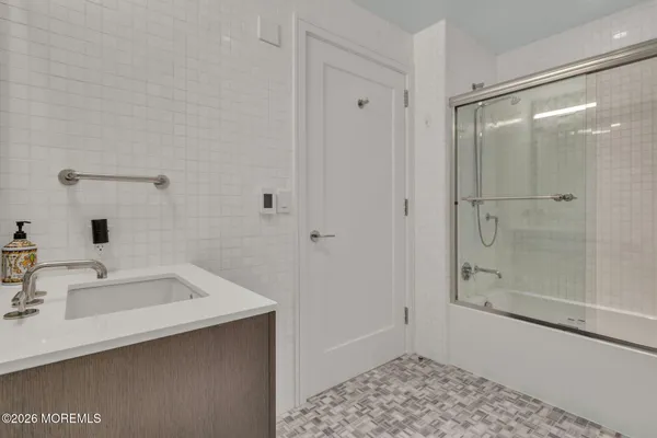 a bathroom with a sink and a shower