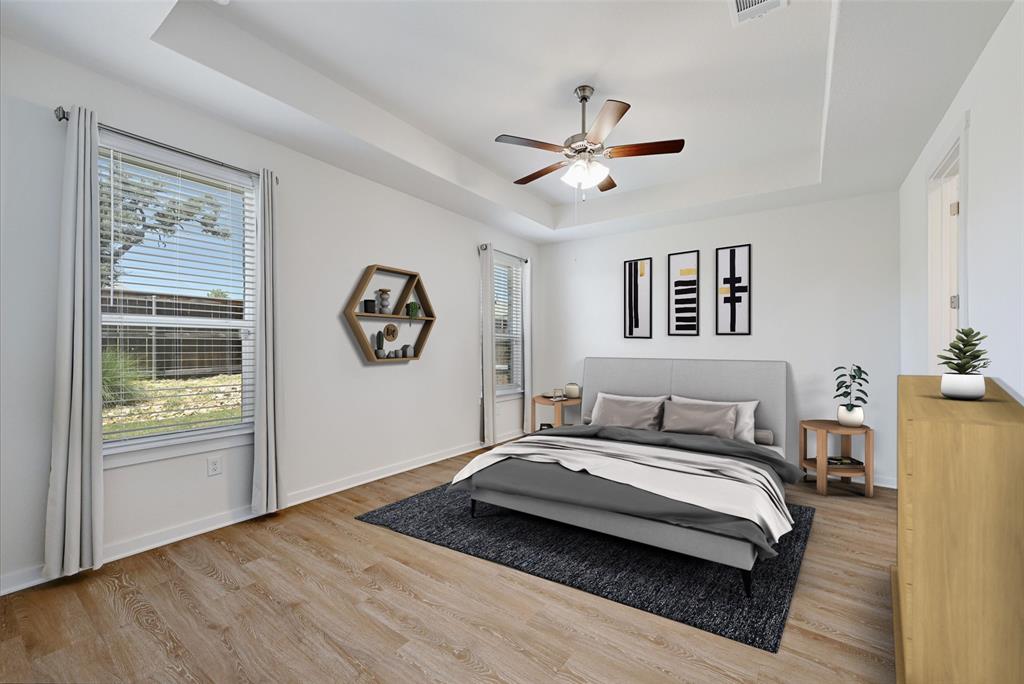 2133 Alamar Walk Leander, TX 78641 - Photo 11 of 25 a bedroom with a bed and a window