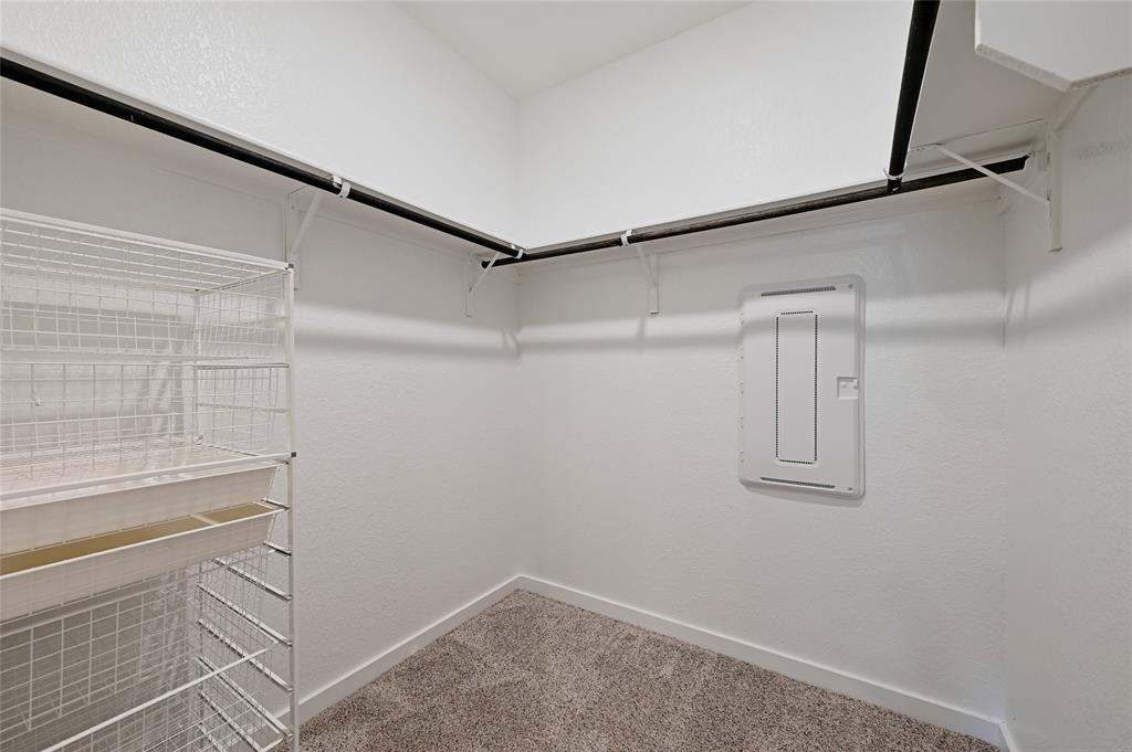 2133 Alamar Walk Leander, TX 78641 - Photo 15 of 25 a view of a room with racks on the wall