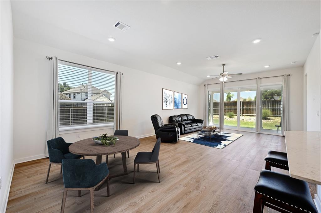 2133 Alamar Walk Leander, TX 78641 - Photo 2 of 25 a view of a dining room with furniture window and outside view