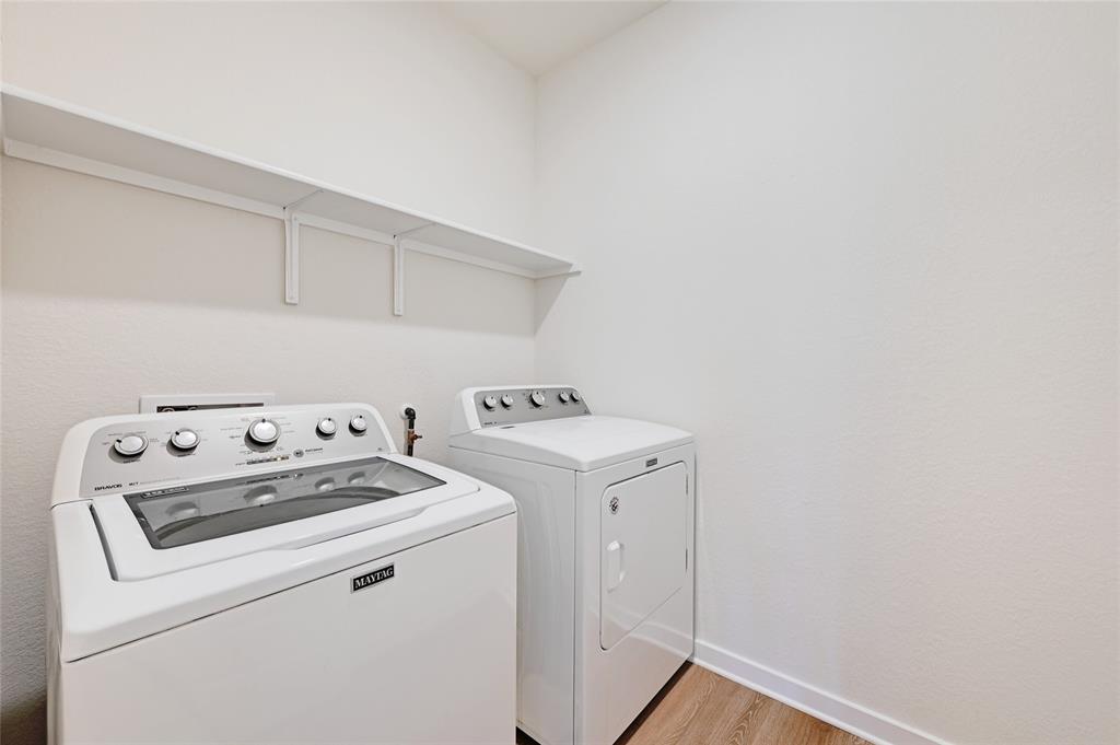 2133 Alamar Walk Leander, TX 78641 - Photo 21 of 25 a utility room with dryer and washer