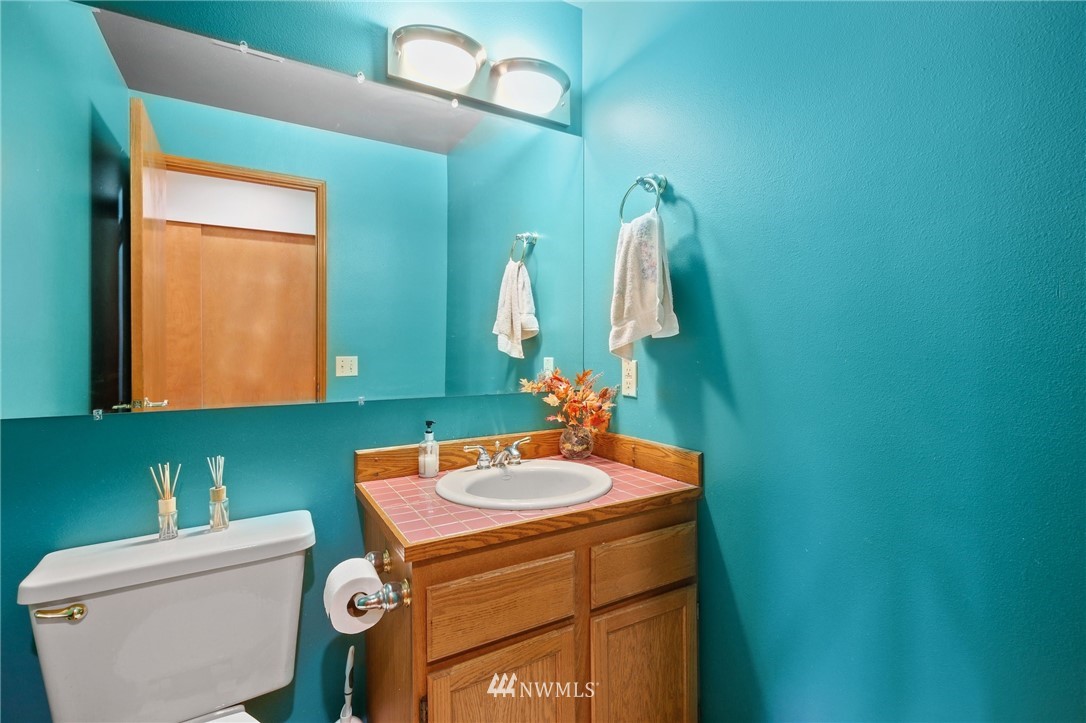 5030 Northeast 21st Street Renton, WA 98059 - Photo 13 of 27 a bathroom with a sink and a toilet