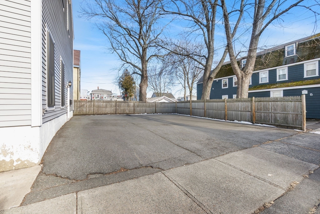85 Bridge Street, Unit 4 Salem, MA 01970 - Photo 30 of 31 a view of a house with a yard and trees