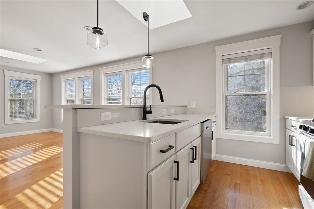 85 Bridge Street, Unit 4 Salem, MA 01970 - Photo 10 of 31 a kitchen with a sink a window and appliances