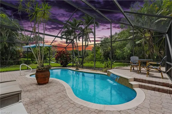 a view of a swimming pool with a patio