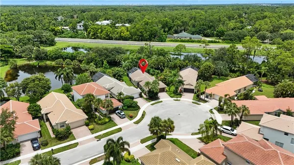 an aerial view of residential house with outdoor space and parking