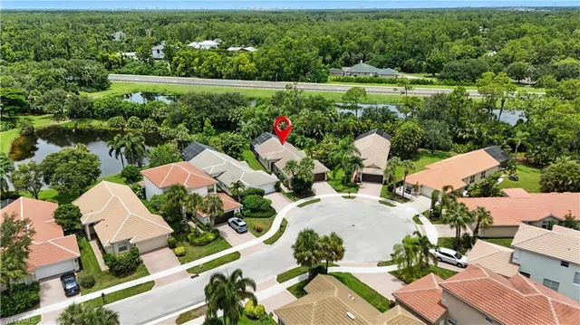 an aerial view of residential house with outdoor space and parking