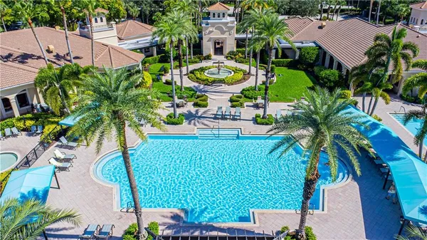 an aerial view of a house yard and swimming pool