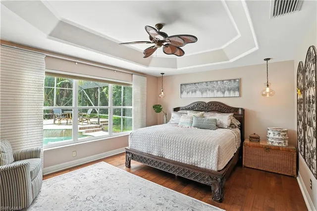 a bedroom with a large bed and a large window