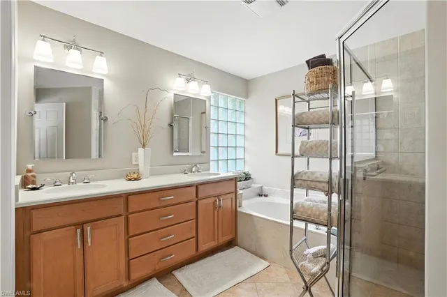 a bathroom with a double vanity sink mirror and double