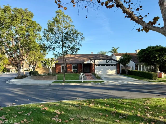 a view of a fountain in front of a house