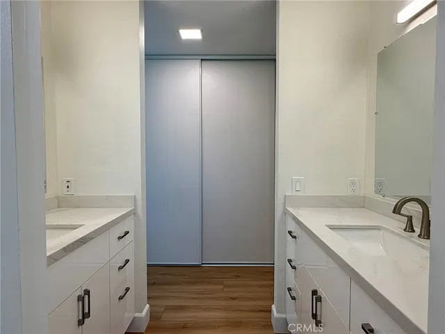 a view of a room with wooden floor