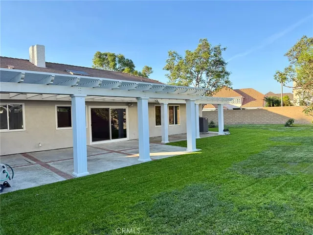 a large green field with lots of bushes
