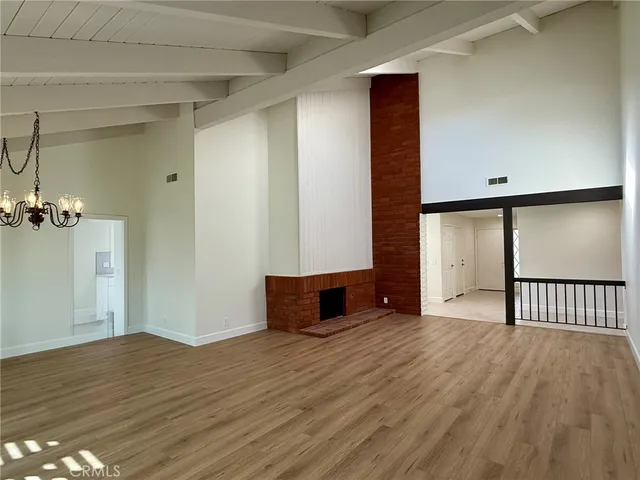 a view of a livingroom with wooden floor