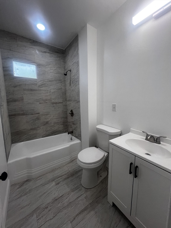 19 Reeves Street Worcester, MA 01607 - Photo 21 of 30 a bathroom with a sink a toilet and bathtub