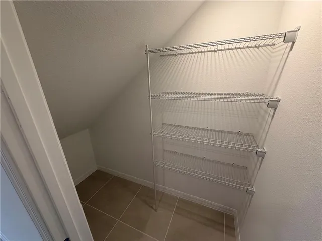 a view of staircase with white walls