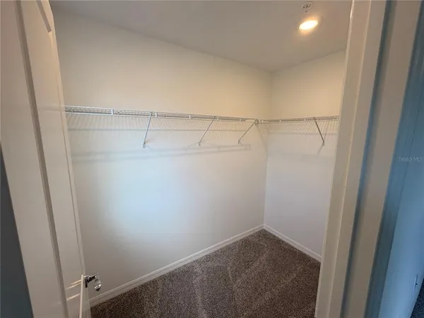 a bathroom with a double vanity sink toilet mirror and shower
