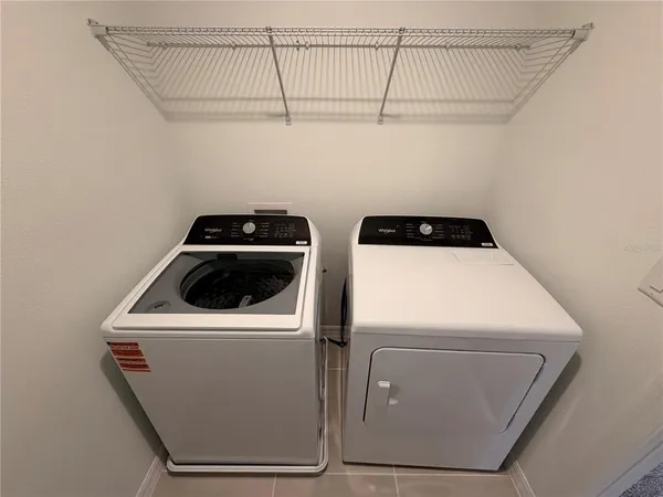 a bathroom with a bathtub shower sink vanity and toilet