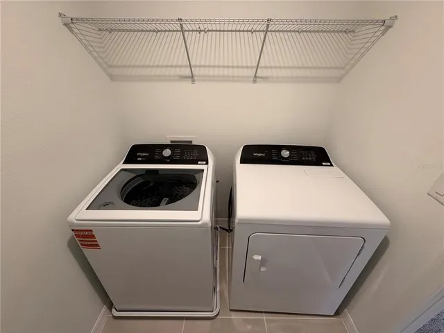 a bathroom with a bathtub shower sink vanity and toilet