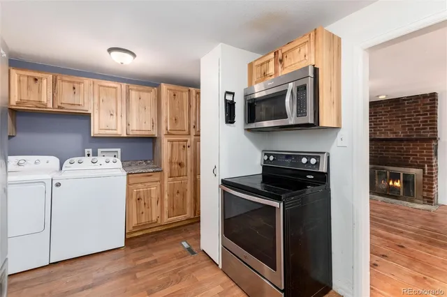 a kitchen with a stove microwave and a sink