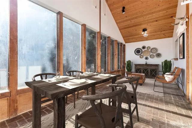 a dining room with furniture and window