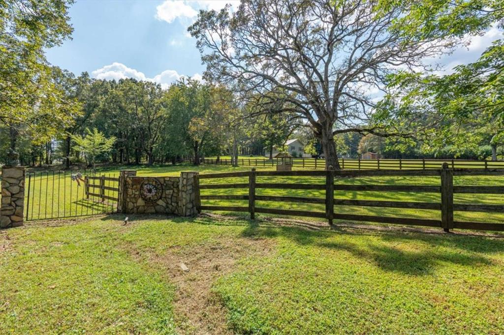 6058 Mt Zion Road Waco, GA 30182 - Photo 2 of 72 a view of a bench in a park