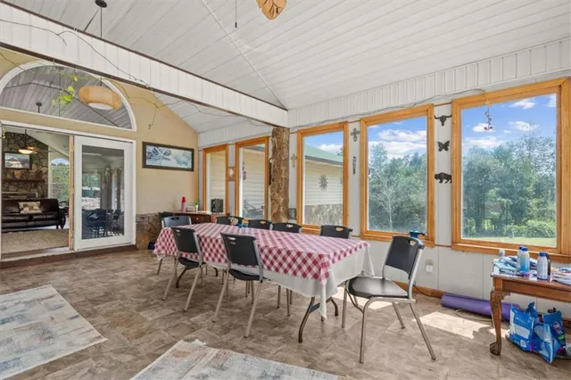 a living room with furniture a fireplace and a chandelier