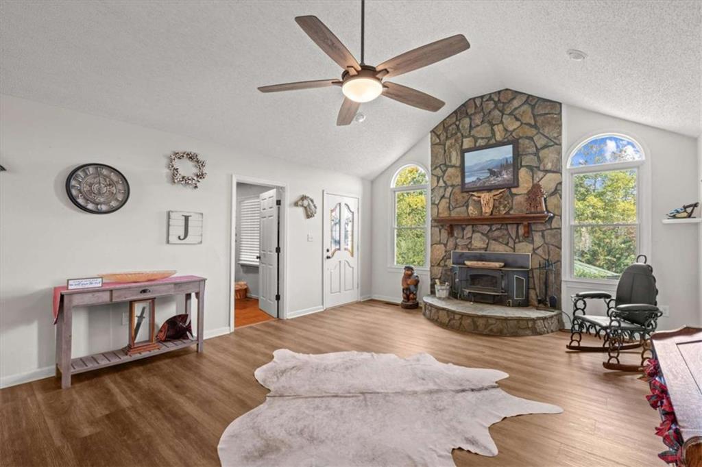 6058 Mt Zion Road Waco, GA 30182 - Photo 24 of 72 a living room with furniture and a fireplace