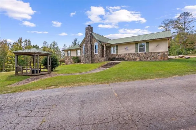 a large bed sitting in a bedroom and dresser