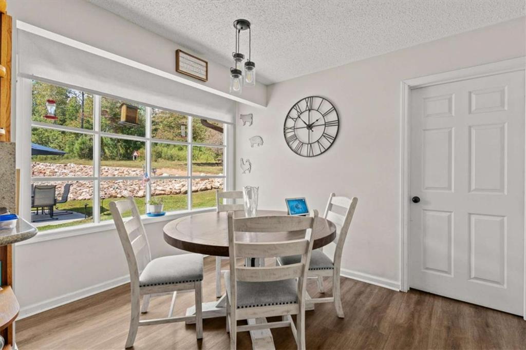 6058 Mt Zion Road Waco, GA 30182 - Photo 36 of 72 a view of a dining area with furniture window and wooden floor
