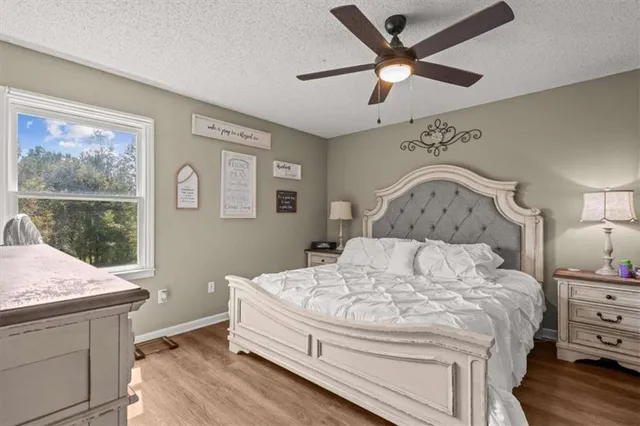 a bathroom with a sink a toilet and shower curtain