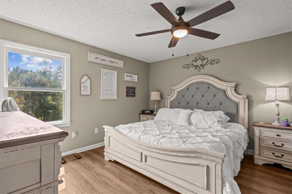 6058 Mt Zion Road Waco, GA 30182 - Photo 40 of 72 a bedroom with a bed and a table