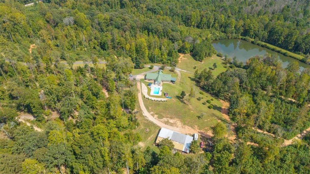 6058 Mt Zion Road Waco, GA 30182 - Photo 4 of 72 a view of a lake with a mountain