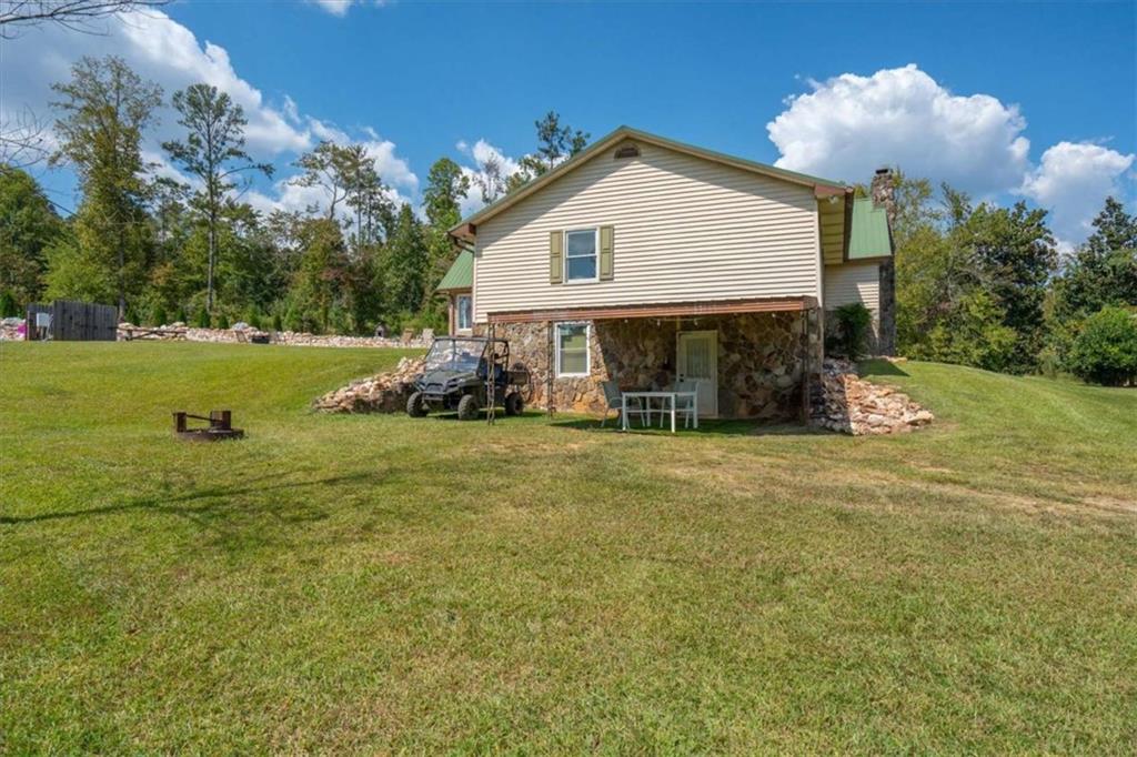 6058 Mt Zion Road Waco, GA 30182 - Photo 60 of 72 a front view of a house with garden