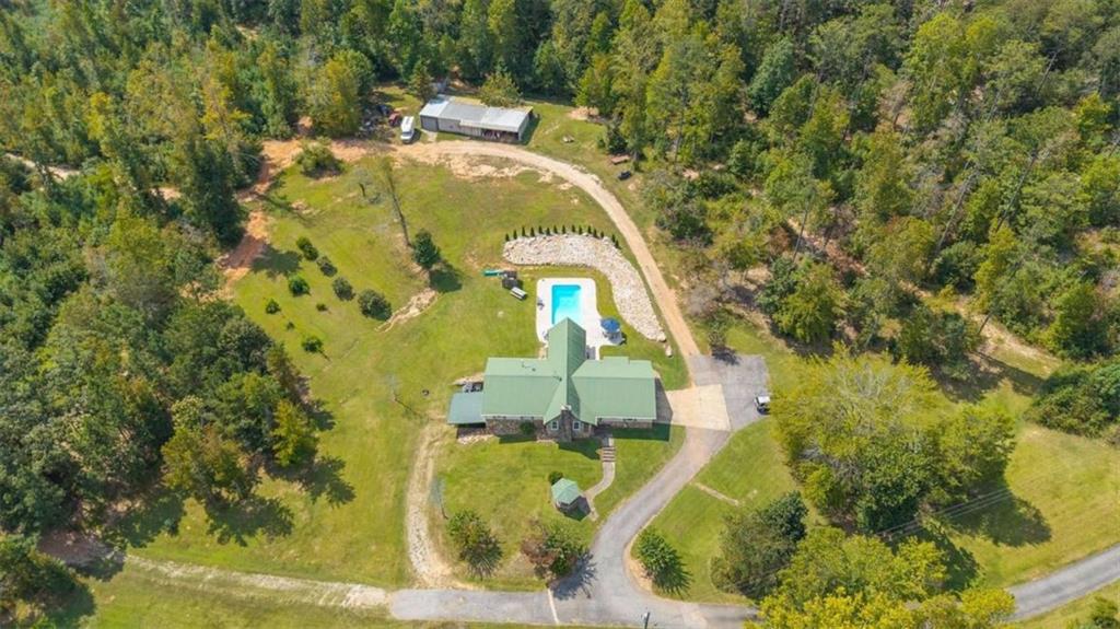 6058 Mt Zion Road Waco, GA 30182 - Photo 68 of 72 a aerial view of a house with swimming pool