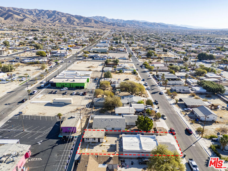 66124 Acoma Avenue, Unit C Desert Hot Springs, CA 92240 - Photo 14 of 18 an aerial view of residential houses with city view