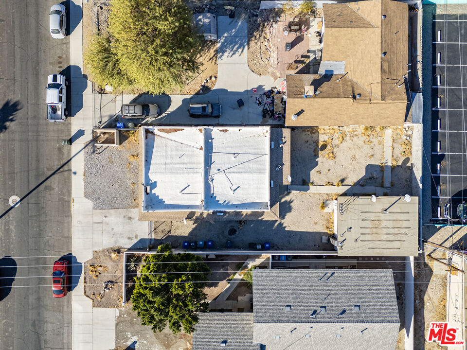 66124 Acoma Avenue, Unit C Desert Hot Springs, CA 92240 - Photo 15 of 18 an aerial view of residential houses with outdoor space