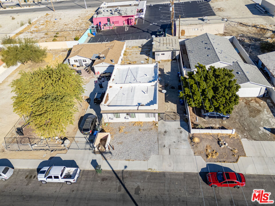 66124 Acoma Avenue, Unit C Desert Hot Springs, CA 92240 - Photo 17 of 18 an aerial view of residential houses with outdoor space