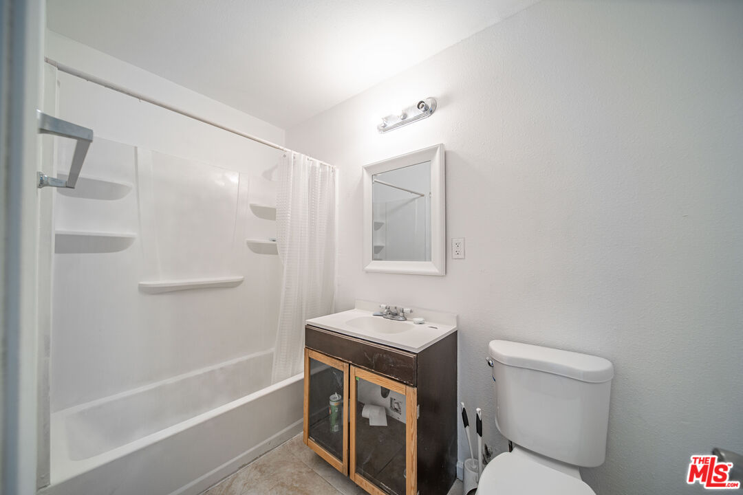 66124 Acoma Avenue, Unit C Desert Hot Springs, CA 92240 - Photo 6 of 18 a bathroom with a sink a toilet and shower