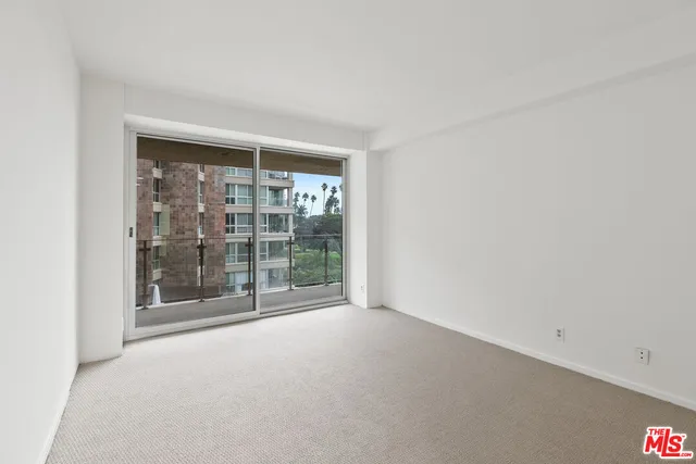 a view of a room with a large window