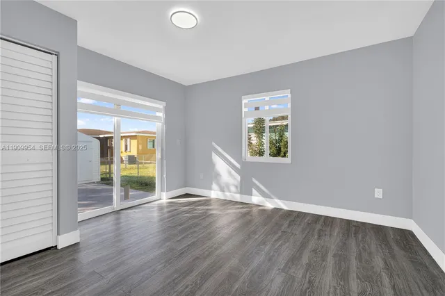 a kitchen with cabinets and stainless steel appliances
