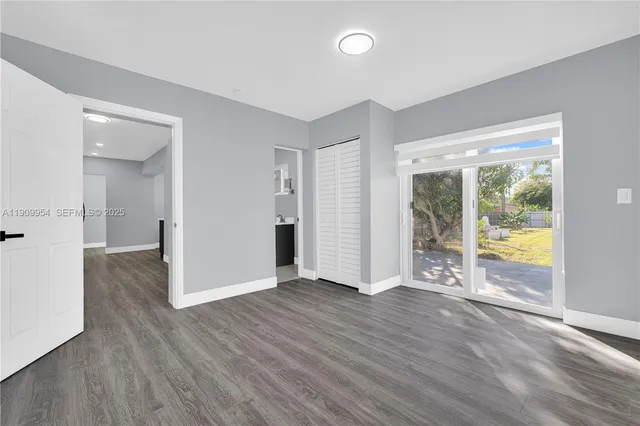 a kitchen with stainless steel appliances granite countertop a sink and a stove top oven